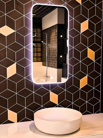 Luxury LED mirror in a high-end bathroom makeover design.